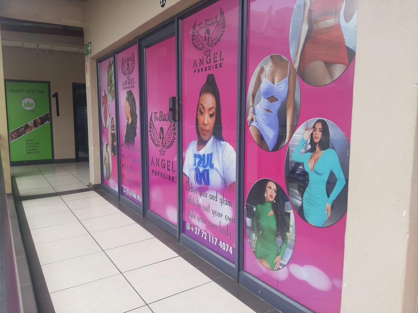 Pink window wraps across The Black Angel Paradise boutique shopfront